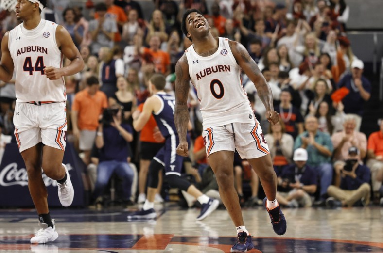 Dec 4, 2021; Auburn, Alabama, USA;  Auburn Tigers guard K.D. Johnson (0) celebrates after hitting a 3-point shot against the Yale Bulldogs during the first half at Auburn Arena. Mandatory Credit: John Reed-USA TODAY Sports