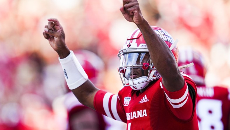 Dec 4, 2021; Lafayette, LA, USA; Louisiana Ragin Cajuns quarterback Levi Lewis (1) celebrates after scoring a touchdown during the second quarter against the Appalachian State Mountaineers during the Sun Belt Conference championship game. Mandatory Credit: Andrew Wevers-USA TODAY Sports