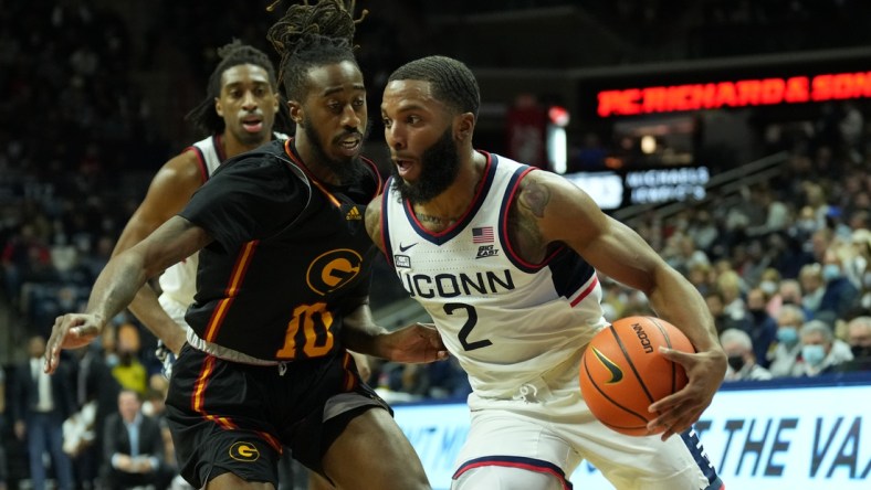 Dec 4, 2021; Storrs, Connecticut, USA; Connecticut Huskies guard R.J. Cole (2) drives the ball against Grambling State Tigers guard Shawndarius Cowart (10) in the first half at Harry A. Gampel Pavilion. Mandatory Credit: David Butler II-USA TODAY Sports