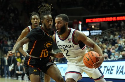 Dec 4, 2021; Storrs, Connecticut, USA; Connecticut Huskies guard R.J. Cole (2) drives the ball against Grambling State Tigers guard Shawndarius Cowart (10) in the first half at Harry A. Gampel Pavilion. Mandatory Credit: David Butler II-USA TODAY Sports