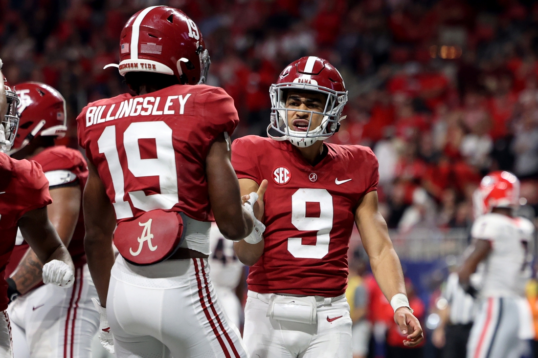 Dec 4, 2021; Atlanta, GA, USA; Alabama Crimson Tide quarterback Bryce Young (9) celebrates his rushing touchdown with tight end Jahleel Billingsley (19) during the second quarter against the Georgia Bulldogs in the SEC championship game at Mercedes-Benz Stadium. Mandatory Credit: Jason Getz-USA TODAY Sports