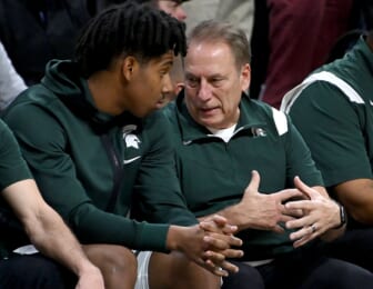 Dec 4, 2021; East Lansing, Michigan, USA;  Michigan State Spartans head coach Tom Izzo talks with Michigan State Spartans guard A.J. Hoggard (11) on the bench in the second half at Jack Breslin Student Events Center. Mandatory Credit: Dale Young-USA TODAY Sports