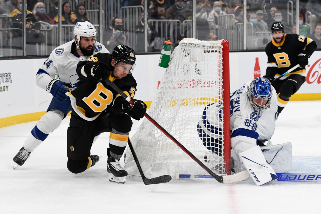 Dec 4, 2021; Boston, Massachusetts, USA; Tampa Bay Lightning goaltender Andrei Vasilevskiy (88) blocks a  attempts a wrap-around shot from Boston Bruins left wing Erik Haula (56) during the first period at TD Garden. Mandatory Credit: Brian Fluharty-USA TODAY Sports