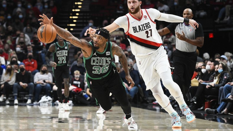 Dec 4, 2021; Portland, Oregon, USA; Boston Celtics guard Marcus Smart (36) steals the ball away from Portland Trail Blazers center Jusuf Nurkic (27) during the first half at Moda Center. Mandatory Credit: Troy Wayrynen-USA TODAY Sports