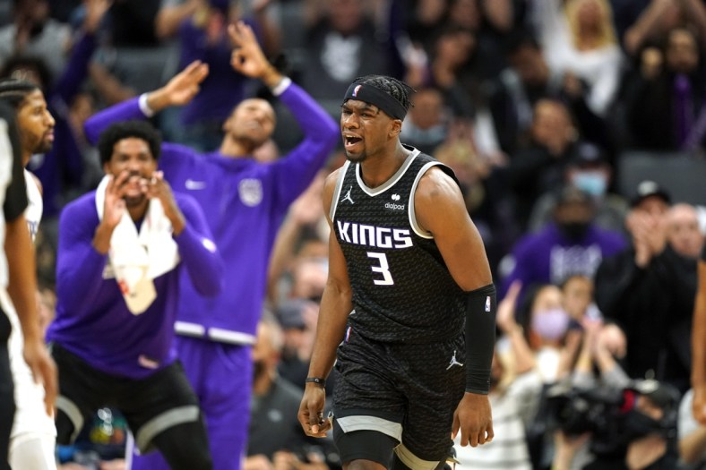 Dec 4, 2021; Sacramento, California, USA; Sacramento Kings guard Terence Davis (3) reacts after hitting a three point basket against the LA Clippers during the fourth quarter at Golden 1 Center. Mandatory Credit: Darren Yamashita-USA TODAY Sports