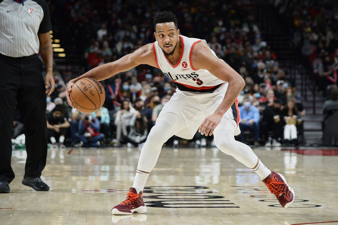 Dec 4, 2021; Portland, Oregon, USA; Portland Trail Blazers guard CJ McCollum (3) dribbles the ball during the second half against the Boston Celtics at Moda Center. The Celtics won 145-117. Mandatory Credit: Troy Wayrynen-USA TODAY Sports