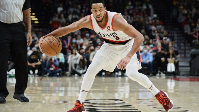 Dec 4, 2021; Portland, Oregon, USA; Portland Trail Blazers guard CJ McCollum (3) dribbles the ball during the second half against the Boston Celtics at Moda Center. The Celtics won 145-117. Mandatory Credit: Troy Wayrynen-USA TODAY Sports