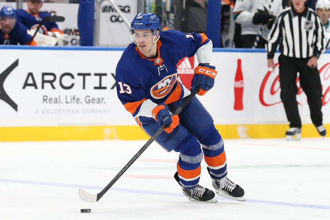 Dec 2, 2021; Elmont, New York, USA; New York Islanders center Mathew Barzal (13) skates with the puck against San Jose Sharks during the second period at UBS Arena. Mandatory Credit: Tom Horak-USA TODAY Sports