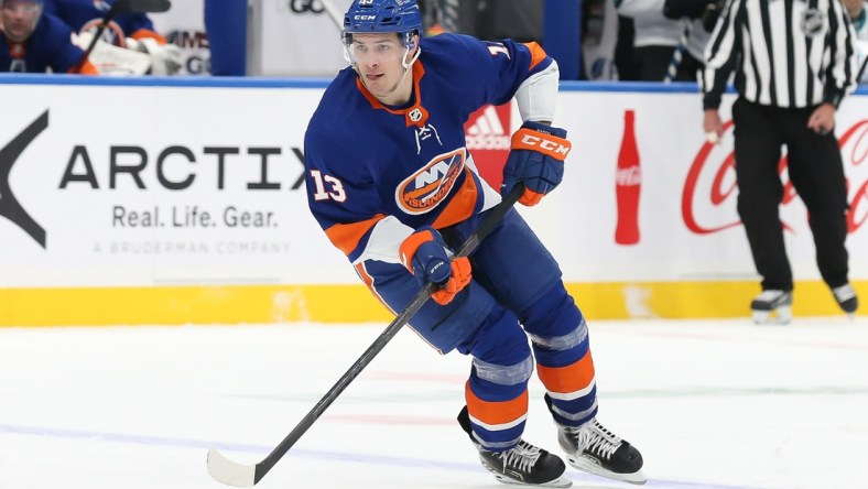 Dec 2, 2021; Elmont, New York, USA; New York Islanders center Mathew Barzal (13) skates with the puck against San Jose Sharks during the second period at UBS Arena. Mandatory Credit: Tom Horak-USA TODAY Sports