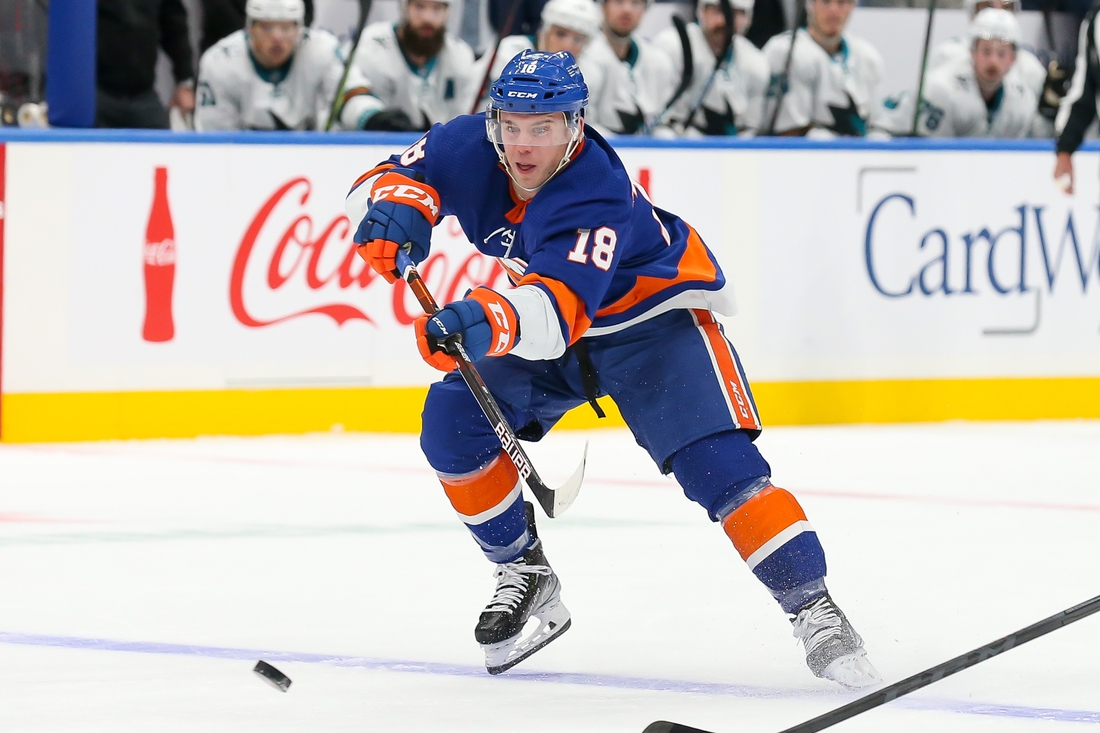 Dec 2, 2021; Elmont, New York, USA; New York Islanders left wing Anthony Beauvillier (18) passes the puck against San Jose Sharks during the second period at UBS Arena. Mandatory Credit: Tom Horak-USA TODAY Sports