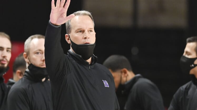 Dec 5, 2021; College Park, Maryland, USA;  Northwestern Wildcats head coach Chris Collins  reacts during the first half against the Maryland Terrapins at Xfinity Center. Mandatory Credit: Tommy Gilligan-USA TODAY Sports