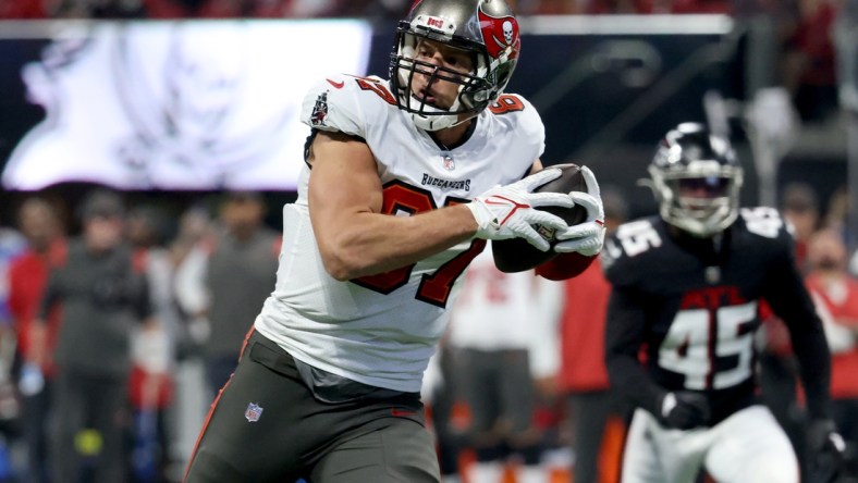 Dec 5, 2021; Atlanta, Georgia, USA; Tampa Bay Buccaneers tight end Rob Gronkowski (87) scores a touchdown during the second quarter against the Atlanta Falcons at Mercedes-Benz Stadium. Mandatory Credit: Jason Getz-USA TODAY Sports