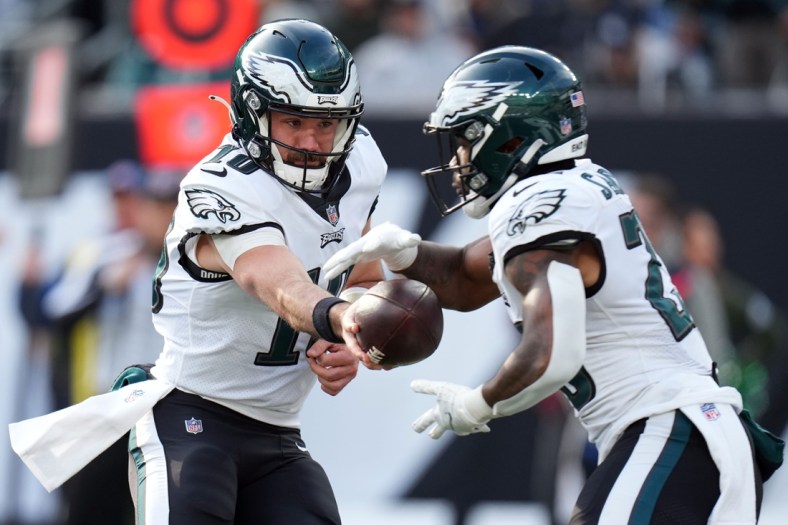 Philadelphia Eagles quarterback Gardner Minshew (10) hands the ball off to running back Miles Sanders (26) in the first half at MetLife Stadium on Sunday, Dec. 5, 2021, in East Rutherford.

Nyj Vs Phi