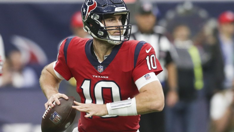 Dec 5, 2021; Houston, Texas, USA;  Houston Texans quarterback Davis Mills (10) scrambles against the Indianapolis Colts in the second half at NRG Stadium. Indianapolis Colts won 31 to 0 .Mandatory Credit: Thomas Shea-USA TODAY Sports