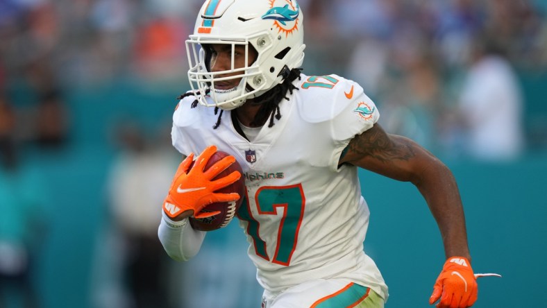 Dec 5, 2021; Miami Gardens, Florida, USA; Miami Dolphins wide receiver Jaylen Waddle (17) runs the ball on a punt return during the second half against the New York Giants at Hard Rock Stadium. Mandatory Credit: Jasen Vinlove-USA TODAY Sports