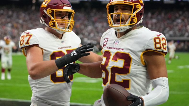 Dec 5, 2021; Paradise, Nevada, USA; Washington Football Team tight end Logan Thomas (82) celebrates with Washington Football Team tight end John Bates (87) after scoring a touchdown against the Las Vegas Raiders during the first quarter at Allegiant Stadium. Mandatory Credit: Stephen R. Sylvanie-USA TODAY Sports