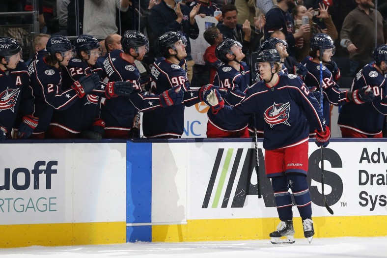 Dec 5, 2021; Columbus, Ohio, USA; Columbus Blue Jackets defenseman Adam Boqvist (27) celebrates a goal against the San Jose Sharks  during the first period at Nationwide Arena. Mandatory Credit: Russell LaBounty-USA TODAY Sports