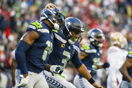 Dec 5, 2021; Seattle, Washington, USA; Seattle Seahawks quarterback Russell Wilson (3) celebrates with wide receiver DK Metcalf (14) after throwing a touchdown pass against the San Francisco 49ers during the third quarter at Lumen Field. Mandatory Credit: Joe Nicholson-USA TODAY Sports