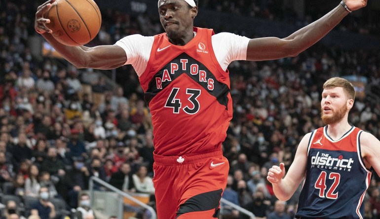 Dec 5, 2021; Toronto, Ontario, CAN Toronto Raptors forward Pascal Siakam (43) tries to control the ball during the third quarter against the Washington Wizards at Scotiabank Arena. Mandatory Credit: Nick Turchiaro-USA TODAY Sports