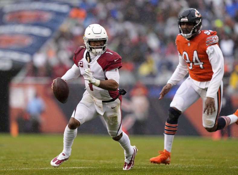 Dec 5, 2021; Chicago, Illinois, USA; Arizona Cardinals quarterback Kyler Murray (1) avoids the tackle of Chicago Bears outside linebacker Robert Quinn (94) during the first quarter at Soldier Field. Mandatory Credit: Mike Dinovo-USA TODAY Sports