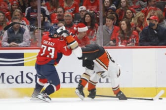 Dec 6, 2021; Washington, District of Columbia, USA; Washington Capitals left wing Conor Sheary (73) checks Anaheim Ducks right wing Vinni Lettieri (28) during the first period at Capital One Arena. Mandatory Credit: Geoff Burke-USA TODAY Sports