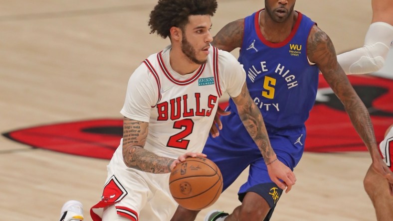 Dec 6, 2021; Chicago, Illinois, USA; Chicago Bulls guard Lonzo Ball (2) drives around Denver Nuggets forward Will Barton (5) during the first quarter at the United Center. Mandatory Credit: Dennis Wierzbicki-USA TODAY Sports