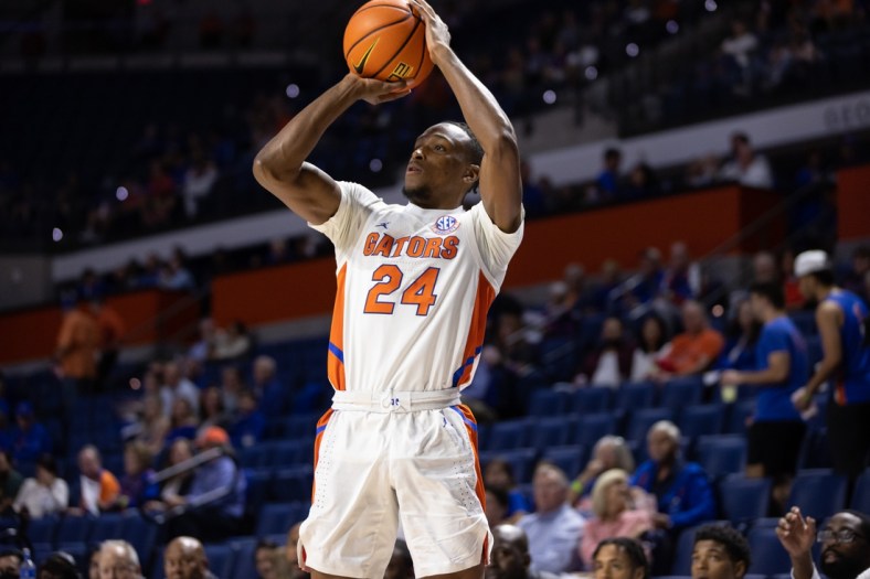 Dec 6, 2021; Gainesville, Florida, USA; Florida Gators guard Phlandrous Fleming Jr. (24) shoots the ball during the first half against the Texas Southern Tigers at Billy Donovan Court at Exactech Arena. Mandatory Credit: Matt Pendleton-USA TODAY Sports