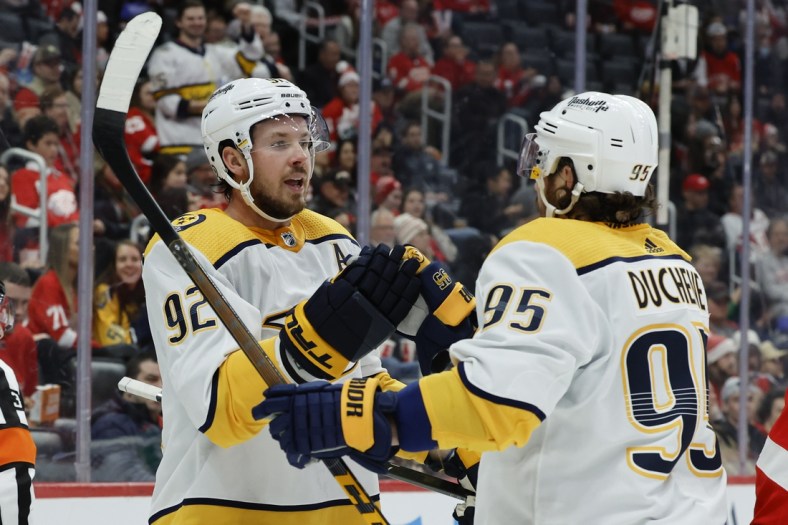 Dec 7, 2021; Detroit, Michigan, USA;  Nashville Predators center Ryan Johansen (92) receives congratulations from center Matt Duchene (95) after scoring in the first period against the Detroit Red Wings in the first period at Little Caesars Arena. Mandatory Credit: Rick Osentoski-USA TODAY Sports