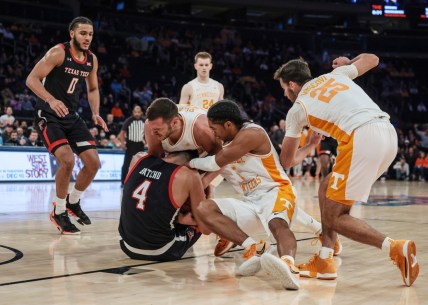 Dec 7, 2021; New York, New York, USA; Texas Tech Red Raiders forward Daniel Batcho (4) battles for a loose ball against Tennessee Volunteers guard Zakai Zeigler (5) and forward Uros Plavsic (33) during the second half at Madison Square Garden. Mandatory Credit: Vincent Carchietta-USA TODAY Sports