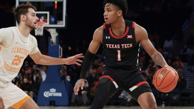 Dec 7, 2021; New York, New York, USA; Texas Tech Red Raiders guard Terrence Shannon Jr. (1) dribbles as Tennessee Volunteers guard Santiago Vescovi (25) defends during the second half at Madison Square Garden. Mandatory Credit: Vincent Carchietta-USA TODAY Sports
