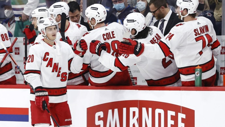 Dec 7, 2021; Winnipeg, Manitoba, CAN; Carolina Hurricanes right wing Sebastian Aho (20) celebrates his second period goal against the Winnipeg Jets at Canada Life Centre. Mandatory Credit: James Carey Lauder-USA TODAY Sports