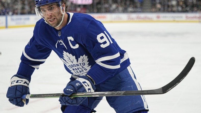 Dec 7, 2021; Toronto, Ontario, CAN; Toronto Maple Leafs forward John Tavares (91) skates against the Columbus Blue Jackets during the second period at Scotiabank Arena. Mandatory Credit: John E. Sokolowski-USA TODAY Sports