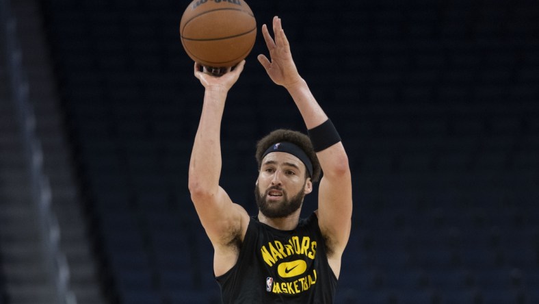 December 8, 2021; San Francisco, California, USA; Golden State Warriors guard Klay Thompson (11) shoots the basketball before the game against the Portland Trail Blazers at Chase Center. Mandatory Credit: Kyle Terada-USA TODAY Sports