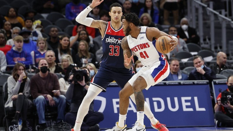 Dec 8, 2021; Detroit, Michigan, USA;  Detroit Pistons forward Saddiq Bey (41) dribbles defended by Washington Wizards forward Kyle Kuzma (33) in the first half at Little Caesars Arena. Mandatory Credit: Rick Osentoski-USA TODAY Sports