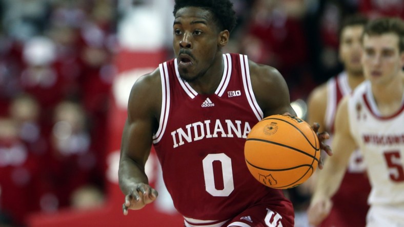 Dec 8, 2021; Madison, Wisconsin, USA; Indiana Hoosiers guard Xavier Johnson (0) drives the ball up the court during the game with the Wisconsin Badgers at the Kohl Center. Mandatory Credit: Mary Langenfeld-USA TODAY Sports