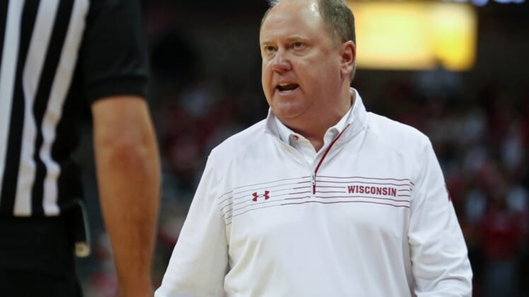 Dec 8, 2021; Madison, Wisconsin, USA;  Wisconsin Badgers head coach Greg Gard disagrees with a referee call during the game with the Indiana Hoosiers at the Kohl Center. Mandatory Credit: Mary Langenfeld-USA TODAY Sports