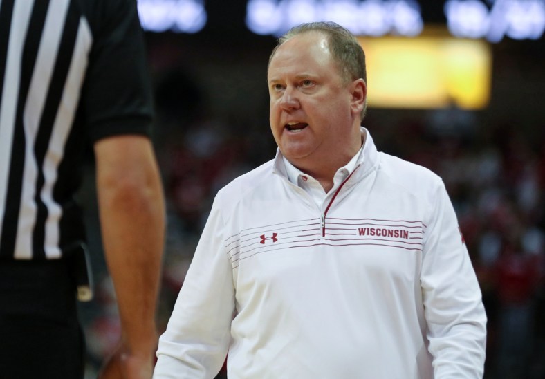 Dec 8, 2021; Madison, Wisconsin, USA;  Wisconsin Badgers head coach Greg Gard disagrees with a referee call during the game with the Indiana Hoosiers at the Kohl Center. Mandatory Credit: Mary Langenfeld-USA TODAY Sports