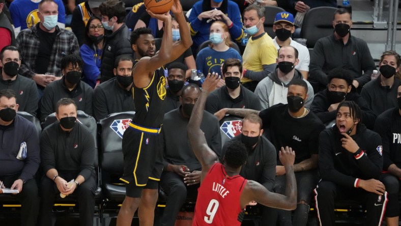 December 8, 2021; San Francisco, California, USA; Golden State Warriors forward Andrew Wiggins (22) shoots the basketball against Portland Trail Blazers forward Nassir Little (9) during the third quarter at Chase Center. Mandatory Credit: Kyle Terada-USA TODAY Sports