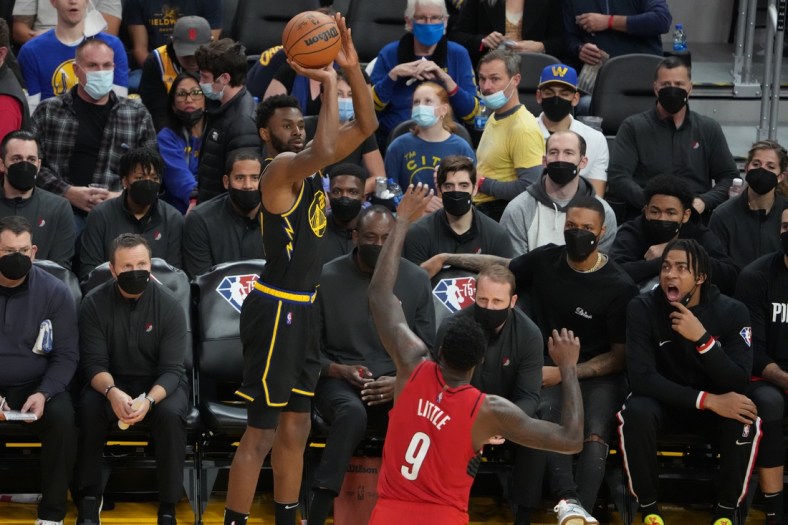 December 8, 2021; San Francisco, California, USA; Golden State Warriors forward Andrew Wiggins (22) shoots the basketball against Portland Trail Blazers forward Nassir Little (9) during the third quarter at Chase Center. Mandatory Credit: Kyle Terada-USA TODAY Sports