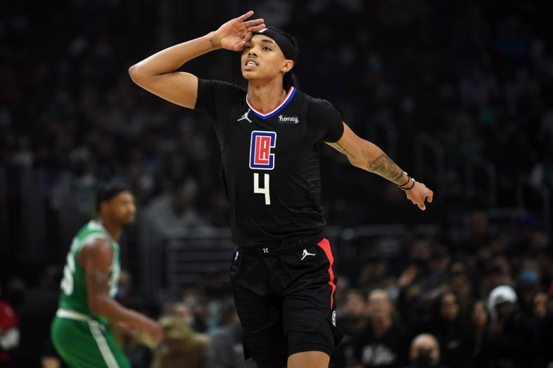 Dec 8, 2021; Los Angeles, California, USA; Los Angeles Clippers guard Brandon Boston Jr. (4) reacts after scoring a three point basket against the Boston Celtics during the first half at Staples Center. Mandatory Credit: Jayne Kamin-Oncea-USA TODAY Sports