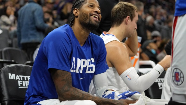 Dec 4, 2021; Sacramento, California, USA; LA Clippers guard Paul George (13) sits on the bench during the second quarter against the Sacramento Kings at Golden 1 Center. Mandatory Credit: Darren Yamashita-USA TODAY Sports