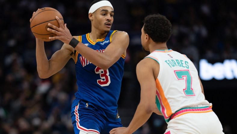 Dec 4, 2021; San Francisco, California, USA;  Golden State Warriors guard Jordan Poole (3) and San Antonio Spurs guard Bryn Forbes (7) during the third quarter at Chase Center. Mandatory Credit: Stan Szeto-USA TODAY Sports