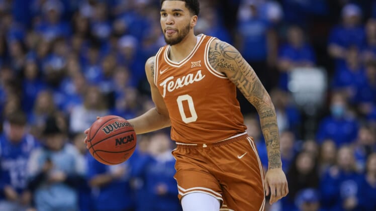 Dec 9, 2021; Newark, New Jersey, USA; Texas Longhorns forward Timmy Allen (0) dribbles up court  against the Seton Hall Pirates during the first half at Prudential Center. Mandatory Credit: Vincent Carchietta-USA TODAY Sports