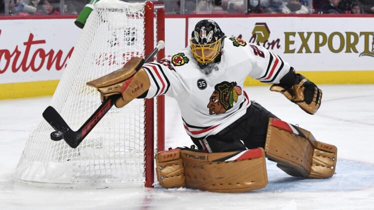 Dec 9, 2021; Montreal, Quebec, CAN; Chicago Blackhawks goalie Marc-Andre Fleury (29) makes a save and redirects the puck during the second period against the Montreal Canadiens at the Bell Centre. Mandatory Credit: Eric Bolte-USA TODAY Sports