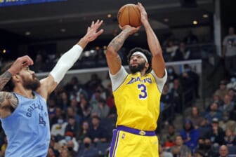 Dec 9, 2021; Memphis, Tennessee, USA; Los Angeles Lakers forward Anthony Davis (3) shoots the ball as Memphis Grizzles center Steven Adams (4) defends during the first half at FedExForum. Mandatory Credit: Petre Thomas-USA TODAY Sports