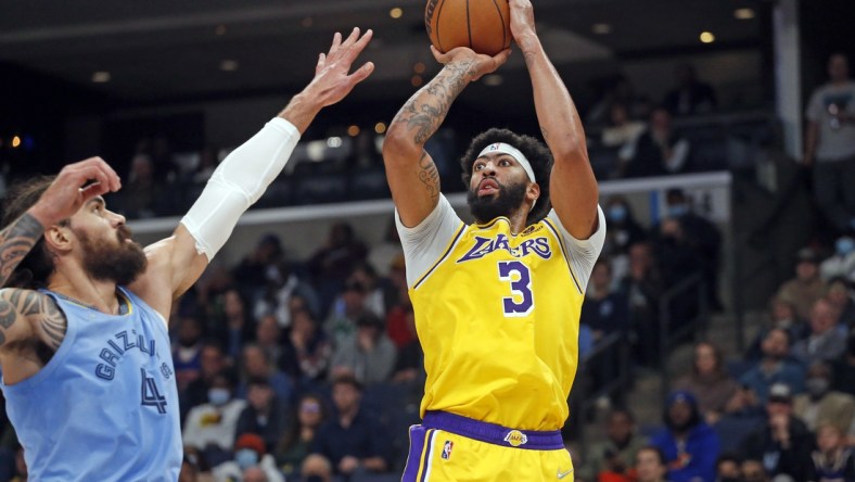 Dec 9, 2021; Memphis, Tennessee, USA; Los Angeles Lakers forward Anthony Davis (3) shoots the ball as Memphis Grizzles center Steven Adams (4) defends during the first half at FedExForum. Mandatory Credit: Petre Thomas-USA TODAY Sports