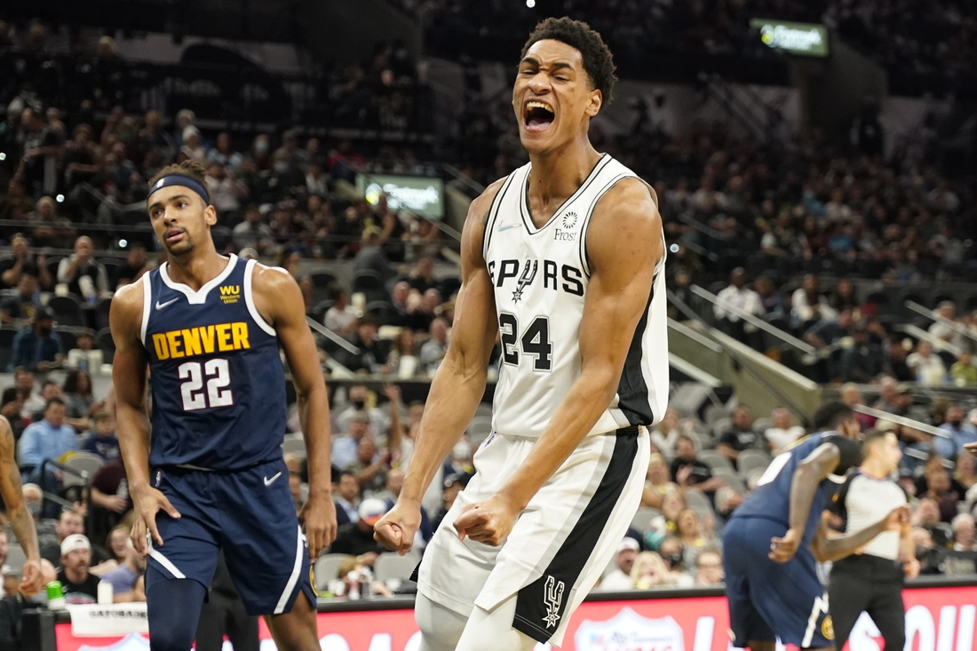 Dec 9, 2021; San Antonio, Texas, USA; San Antonio Spurs guard Devin Vassell (24) reacts after a dunk during the first half against the Denver Nuggets at AT&T Center. Mandatory Credit: Scott Wachter-USA TODAY Sports