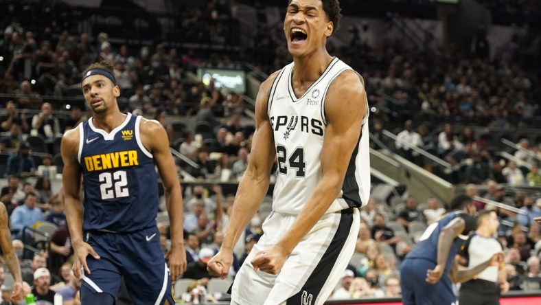 Dec 9, 2021; San Antonio, Texas, USA; San Antonio Spurs guard Devin Vassell (24) reacts after a dunk during the first half against the Denver Nuggets at AT&T Center. Mandatory Credit: Scott Wachter-USA TODAY Sports