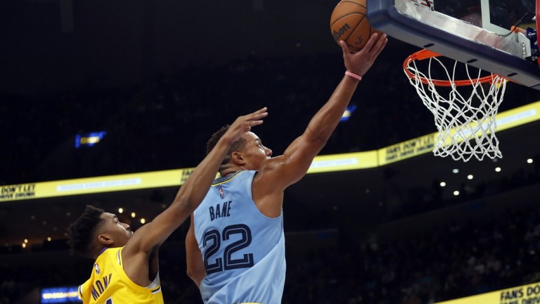 Dec 9, 2021; Memphis, Tennessee, USA; Memphis Grizzles guard Desmond Bane (22) drives to the basket as Los Angeles Lakers guard Malik Monk (11) defends during the second half at FedExForum. Mandatory Credit: Petre Thomas-USA TODAY Sports