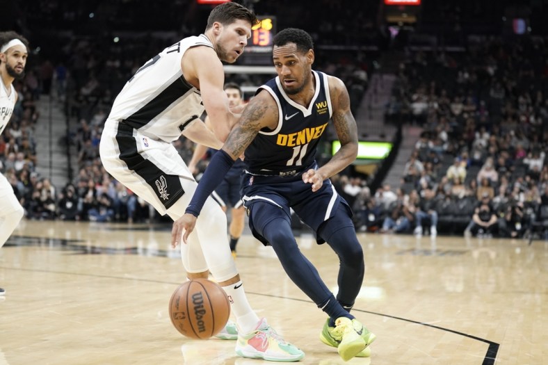 Dec 9, 2021; San Antonio, Texas, USA; Denver Nuggets guard Monte Morris (11) drives to the basket while defended by forward Doug McDermott (17) during the second half at AT&T Center. Mandatory Credit: Scott Wachter-USA TODAY Sports